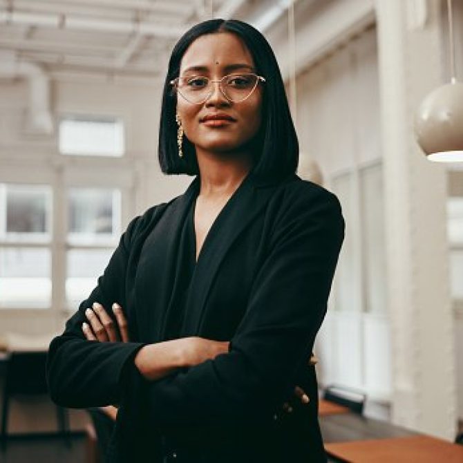 Portrait of a confident young businesswoman working in a modern office